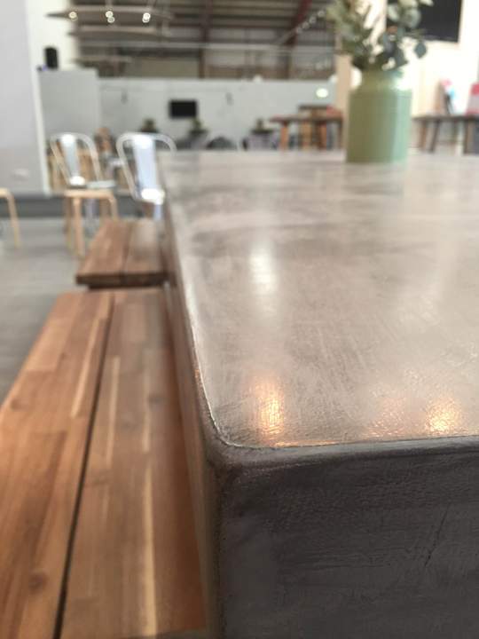 Polished Concrete Tables by Daniel, close up of a concrete table